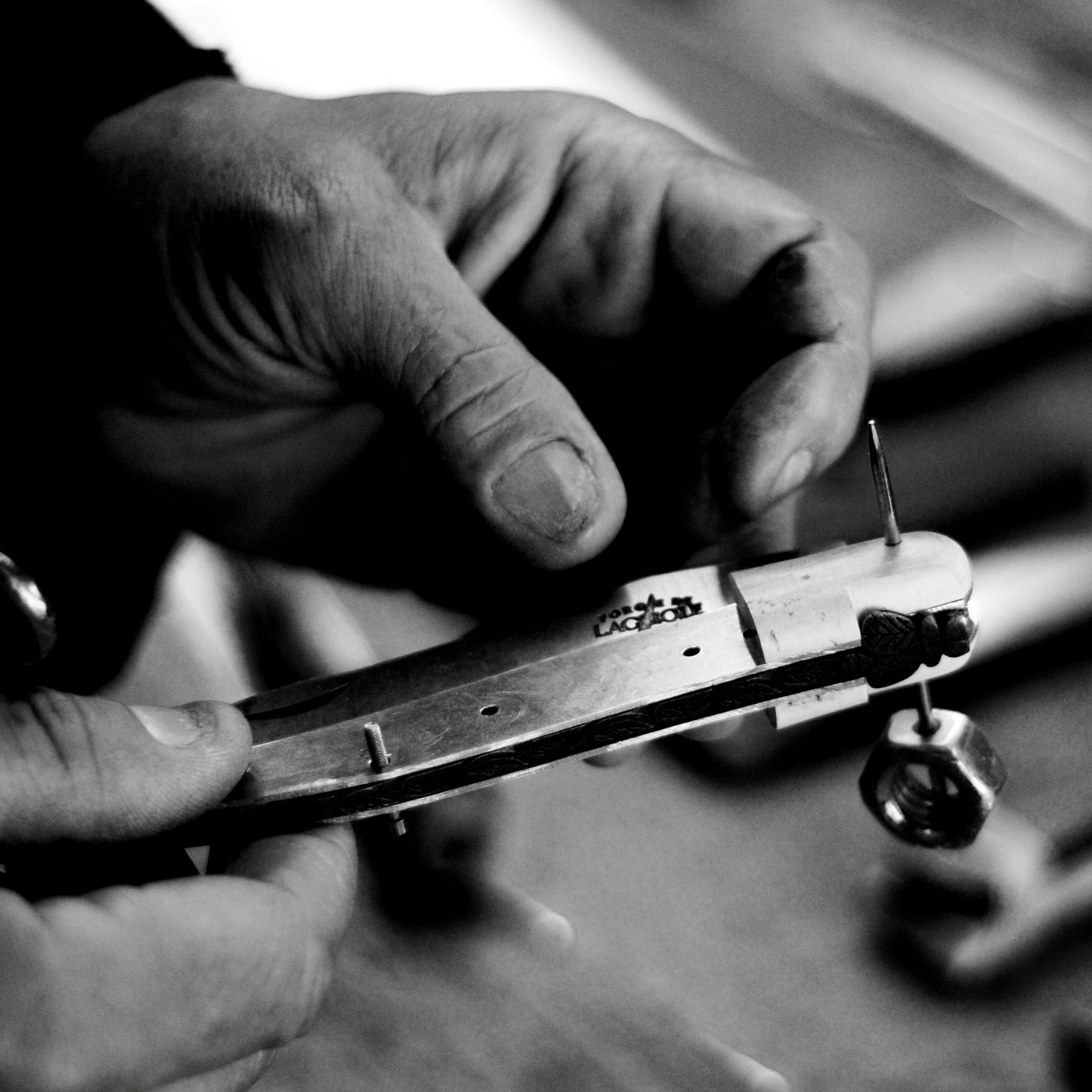 A Forge de Laguiole artisan assembling a laguiole pocket knife