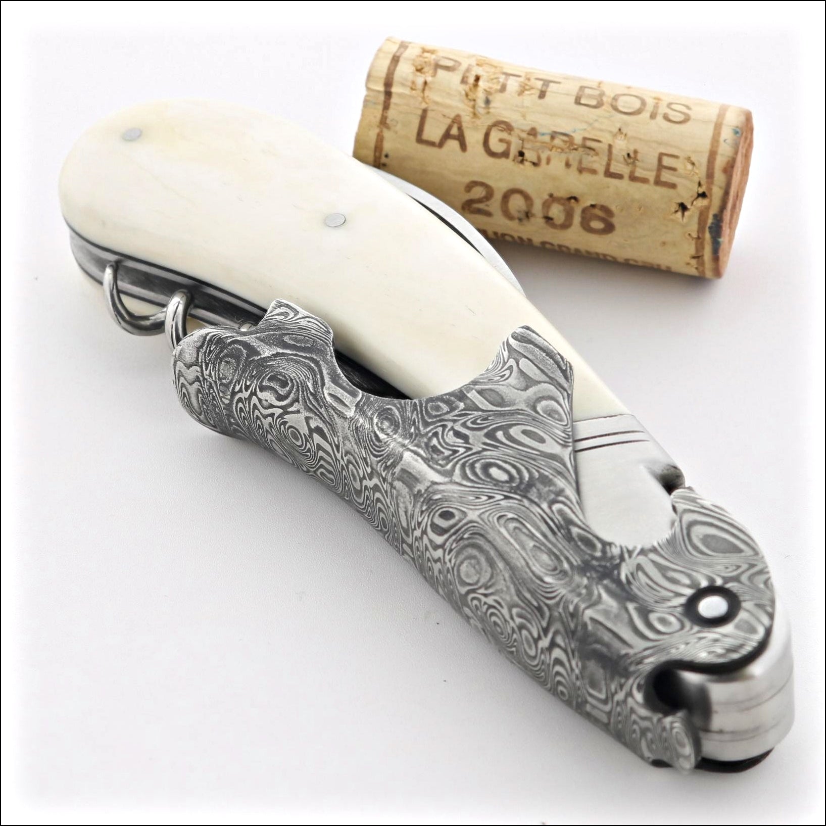 https://www.laguiole-imports.com/cdn/shop/files/Laguiole-Magnum-Damascus-Cattle-Bone-Corkscrew-Fontenille-Pataud.jpg?v=1703846272