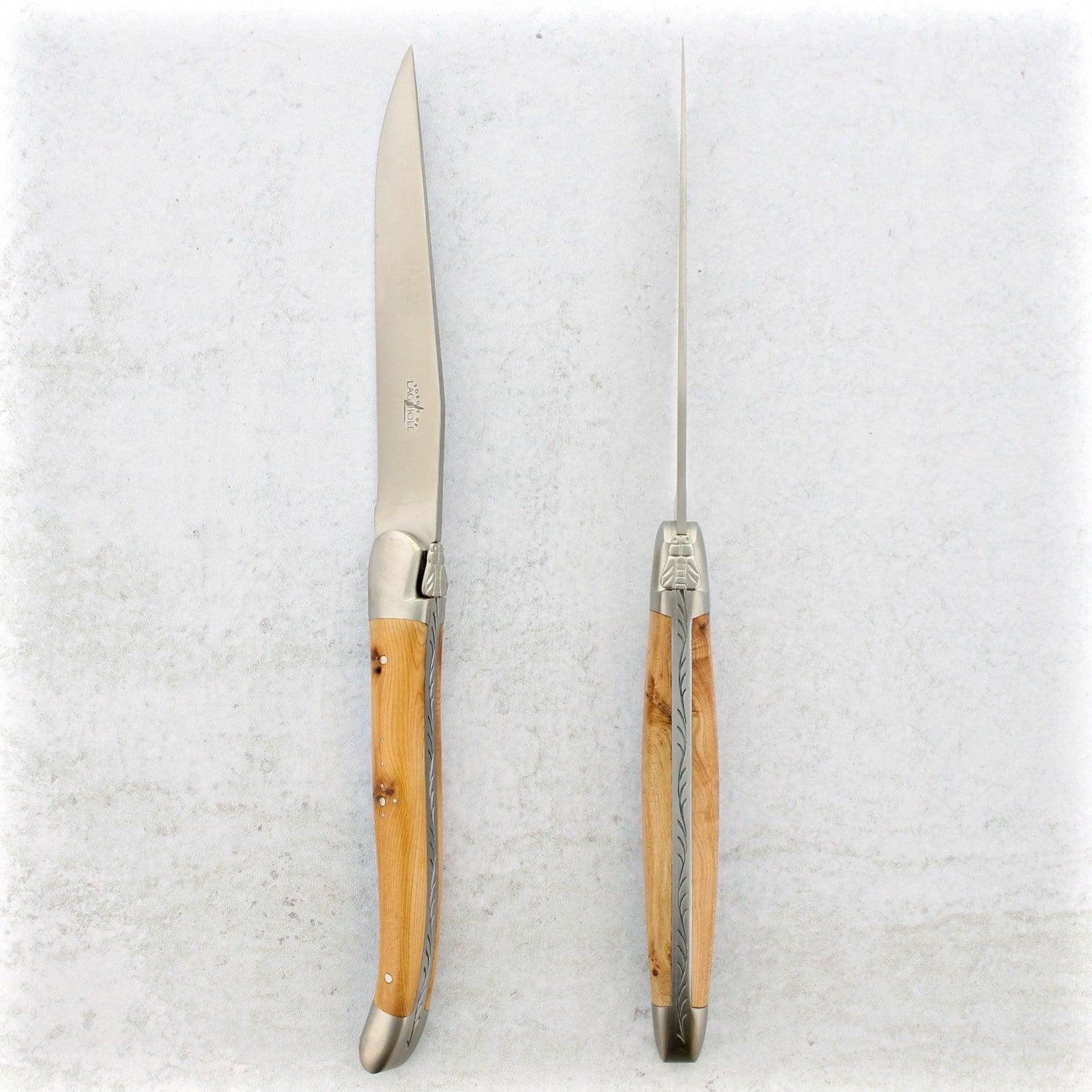 https://www.laguiole-imports.com/cdn/shop/products/Forge-de-Laguiole-Juniper-Wood-Steak-Knives-Brushed-Forge-de-Laguiole-2.jpg?v=1674998991