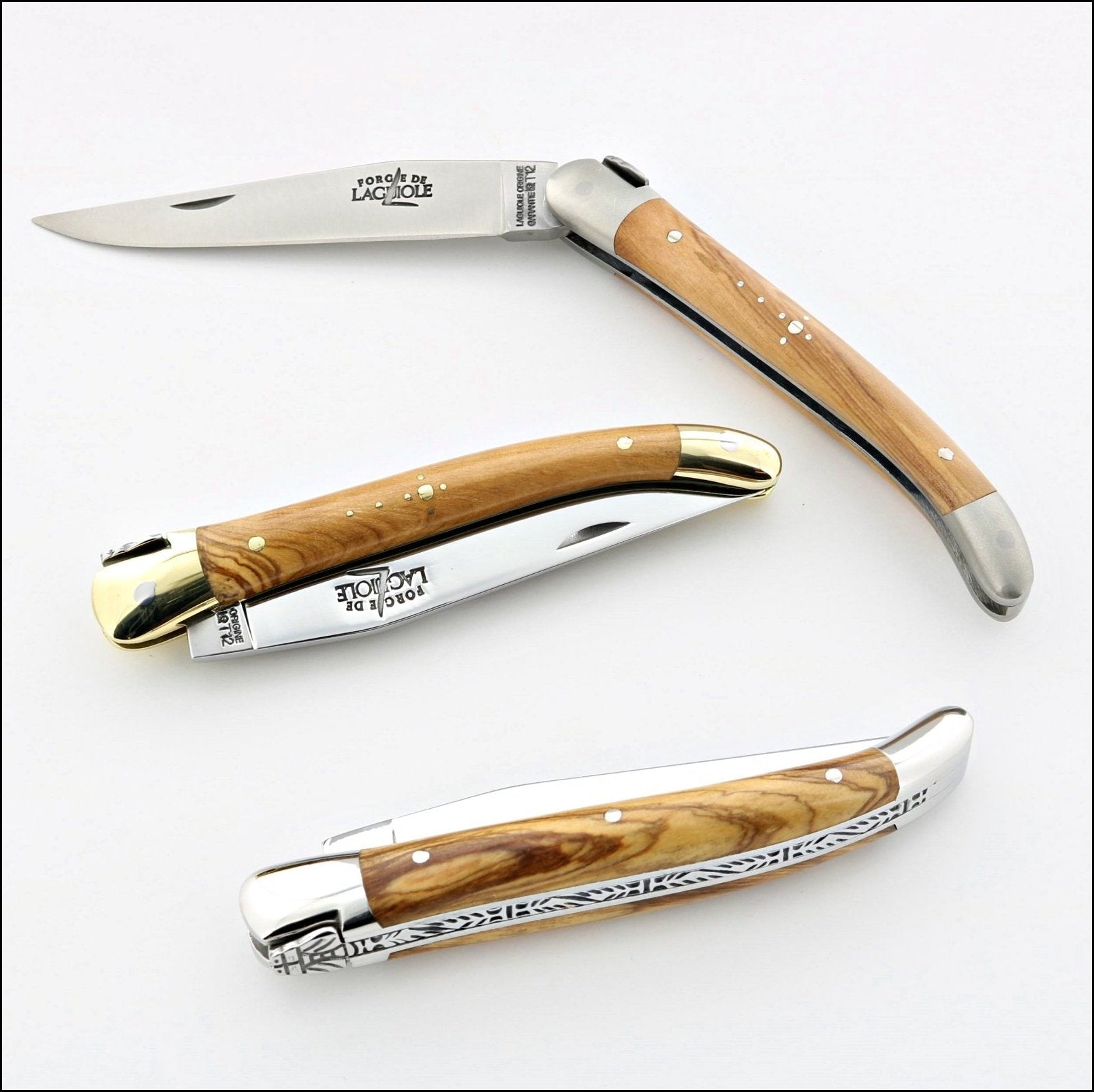 Laguiole knife with olive wood handle and brass bolsters Actiforge