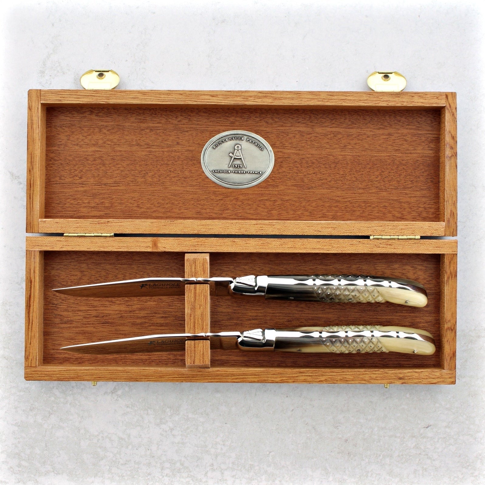 https://www.laguiole-imports.com/cdn/shop/products/Laguiole-Forged-Steak-Knives-Studded-Horn-Tip-Set-of-2-Fontenille-Pataud-2.jpg?v=1666213633