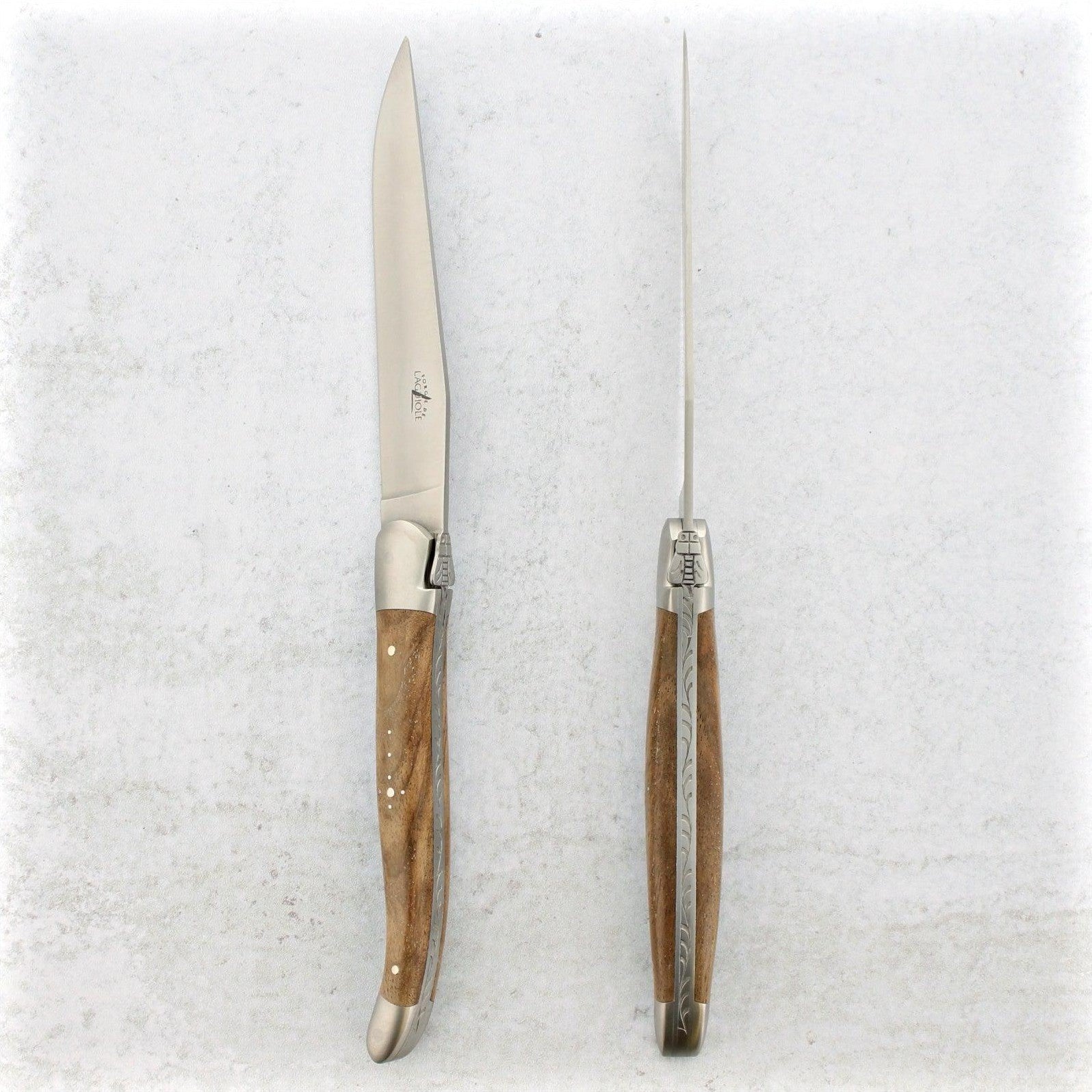 https://www.laguiole-imports.com/cdn/shop/products/Laguiole-Steak-Knives-Walnut-Handle-Satin-Finish-Forge-de-Laguiole-2.jpg?v=1674999005