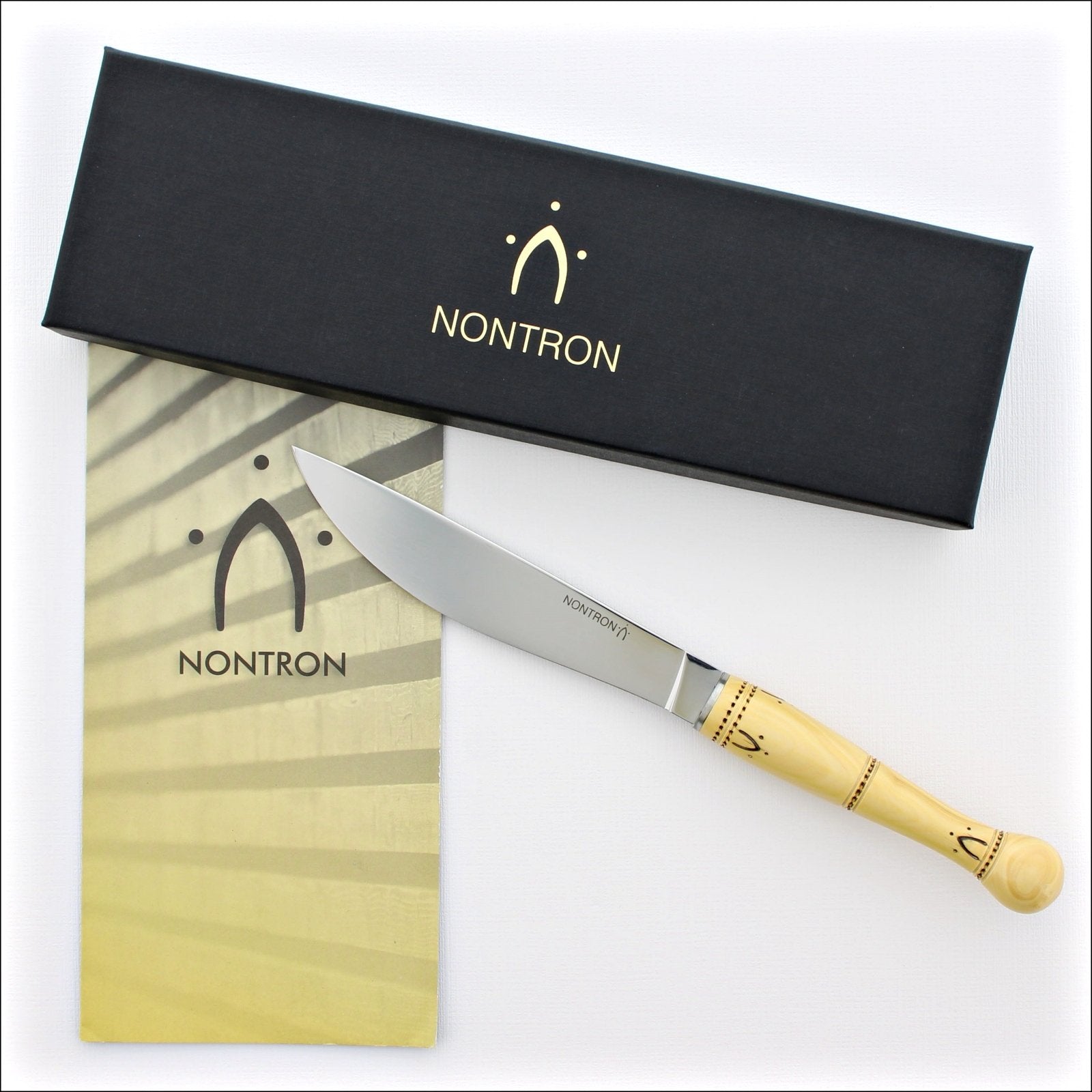https://www.laguiole-imports.com/cdn/shop/products/Nontron-Cheese-Knife-Boxwood-Handle-Nontron-France_1600x.jpg?v=1633084312